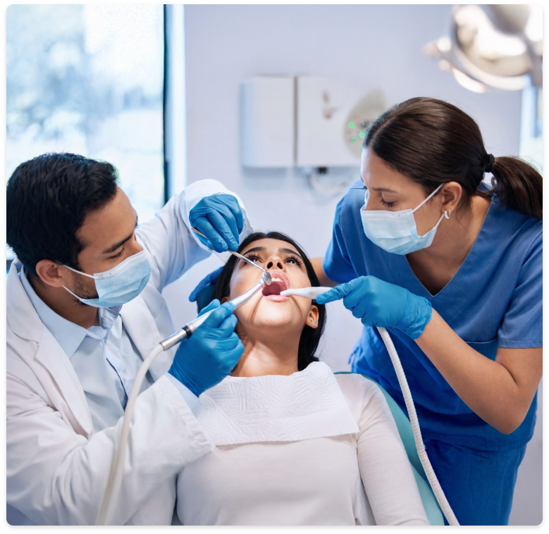 Dental professionals working with patient
